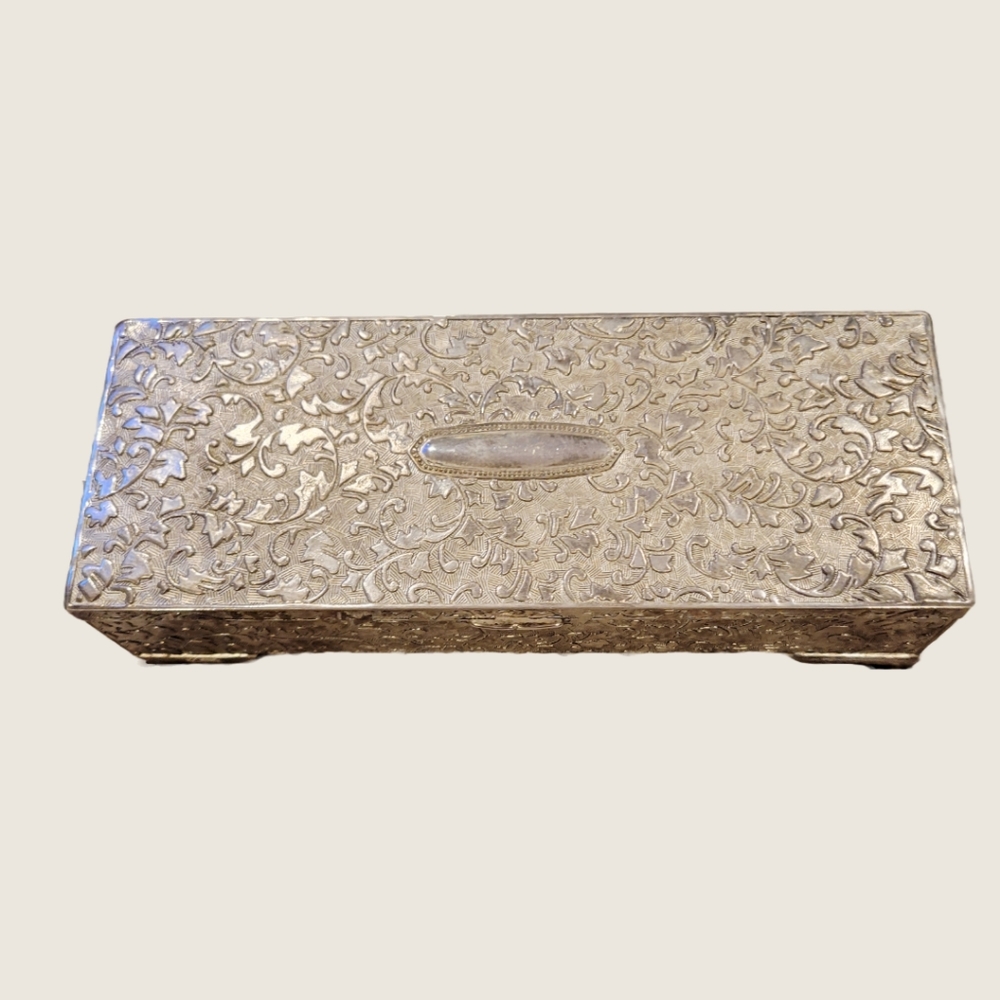 Vintage silver jewlery box with burgundy red trim.